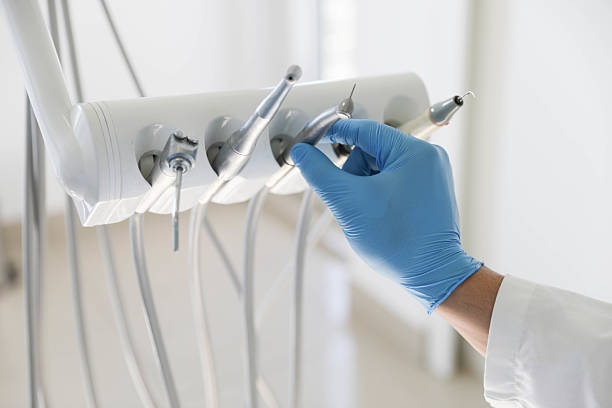 Professional Root Canal Treatment technician working in Port Jefferson Station, NY